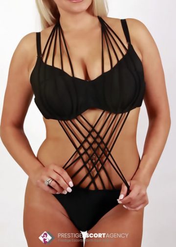 Woman wearing black lingerie with multiple straps