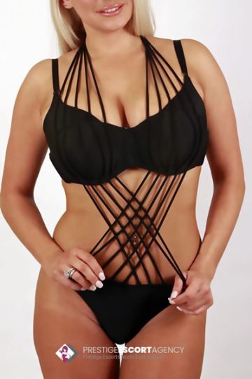 Woman wearing black lingerie with multiple straps