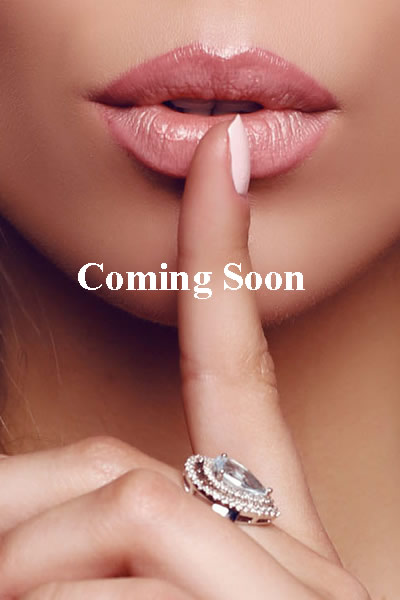 Woman with finger to lips, 'Coming Soon'.