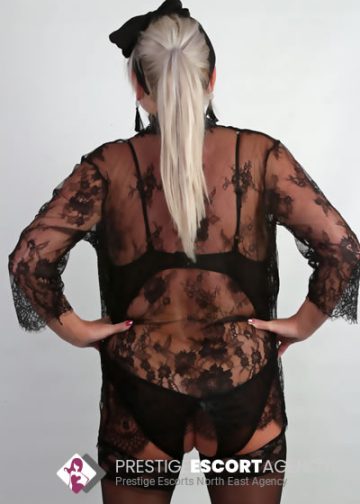 Person in black lace lingerie from behind.