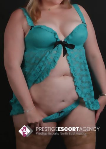 Prestige escort in teal lingerie.