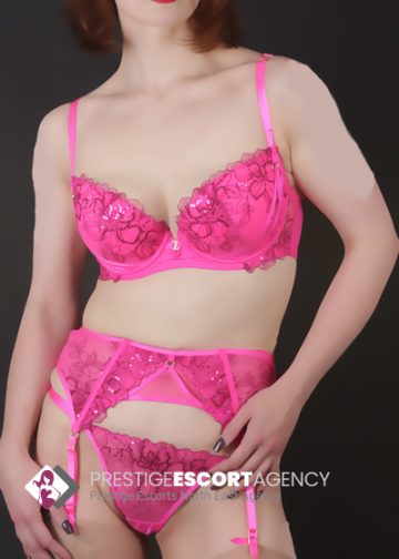 Woman in pink lingerie from Prestige Escort Agency.