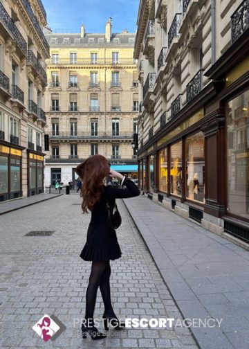 Woman posing on European city street